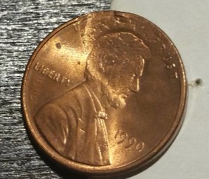 1990-LMC-Major-Struck-Through-Possible-Washer?-Or-Damage?