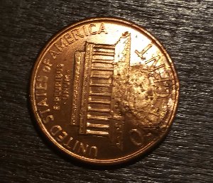 1990-LMC-Major-Struck-Through-Possible-Washer?-Or-Damage?