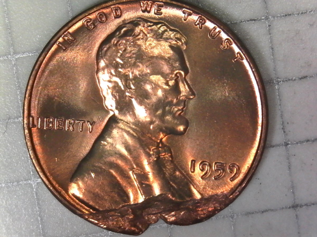 1959-Penny-Not-Sure-If-Error,-Clipped-Or-Just-Damaged.