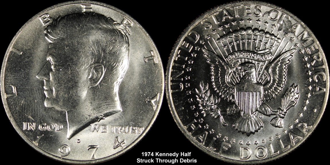 1974-D-Kennedy-Half-Struck-Through-Debris