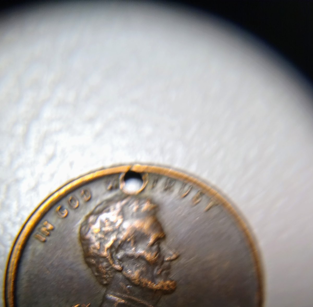 Hole-In-Penny?-Anyone-Know-Why?