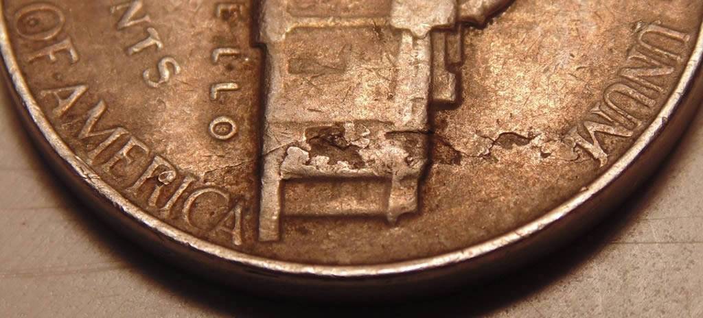 1964-Nickel.-Strike-Through,-Lam-Or-Both?