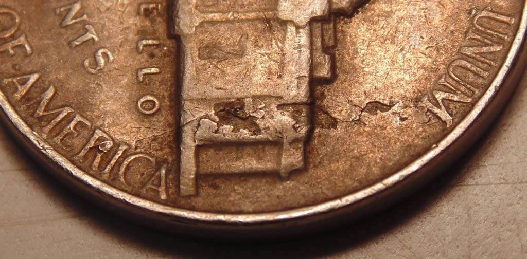 1964-Nickel.-Strike-Through,-Lam-Or-Both?