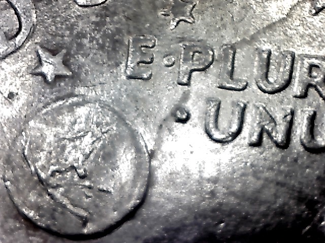 1971-Ike-Dollar-With-Something-Underneath-The-Strike?-Doubling-As-Well-Help