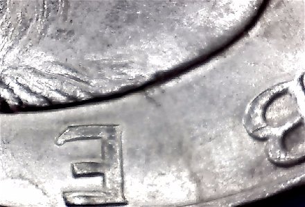 1971-Ike-Dollar-With-Something-Underneath-The-Strike?-Doubling-As-Well-Help