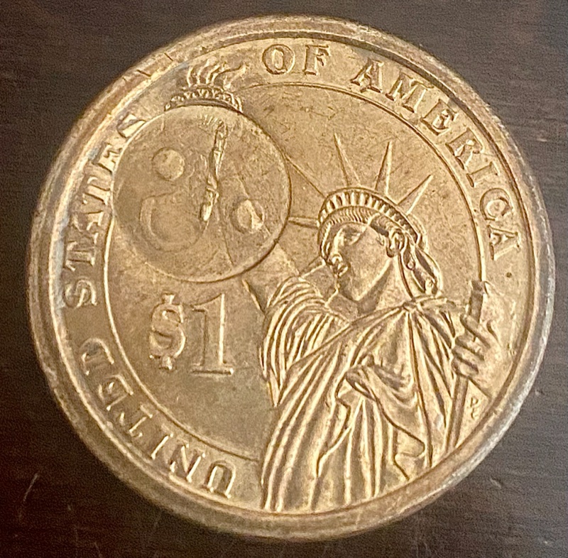 2009-$1-Coin-Error?-Or-Man-Made?