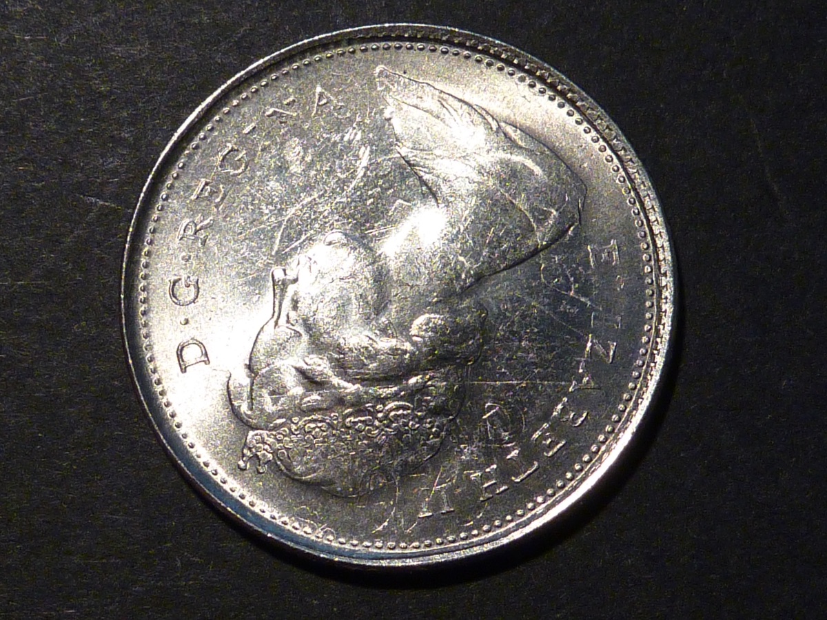 1975-Quarter-On-1966-5-Cents;-What?
