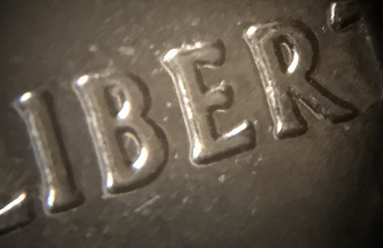 2nd-2002-Quarter-Doubled-Die?--Also-Something-In-Between-The-