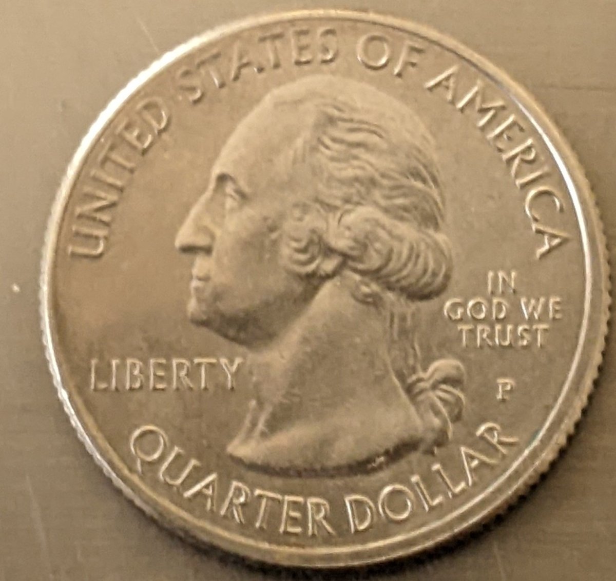 2018-Quarter-Mad-On-The-Obverse-Struck-Through-Retained-Copper-Foil-On-The-Reverse?