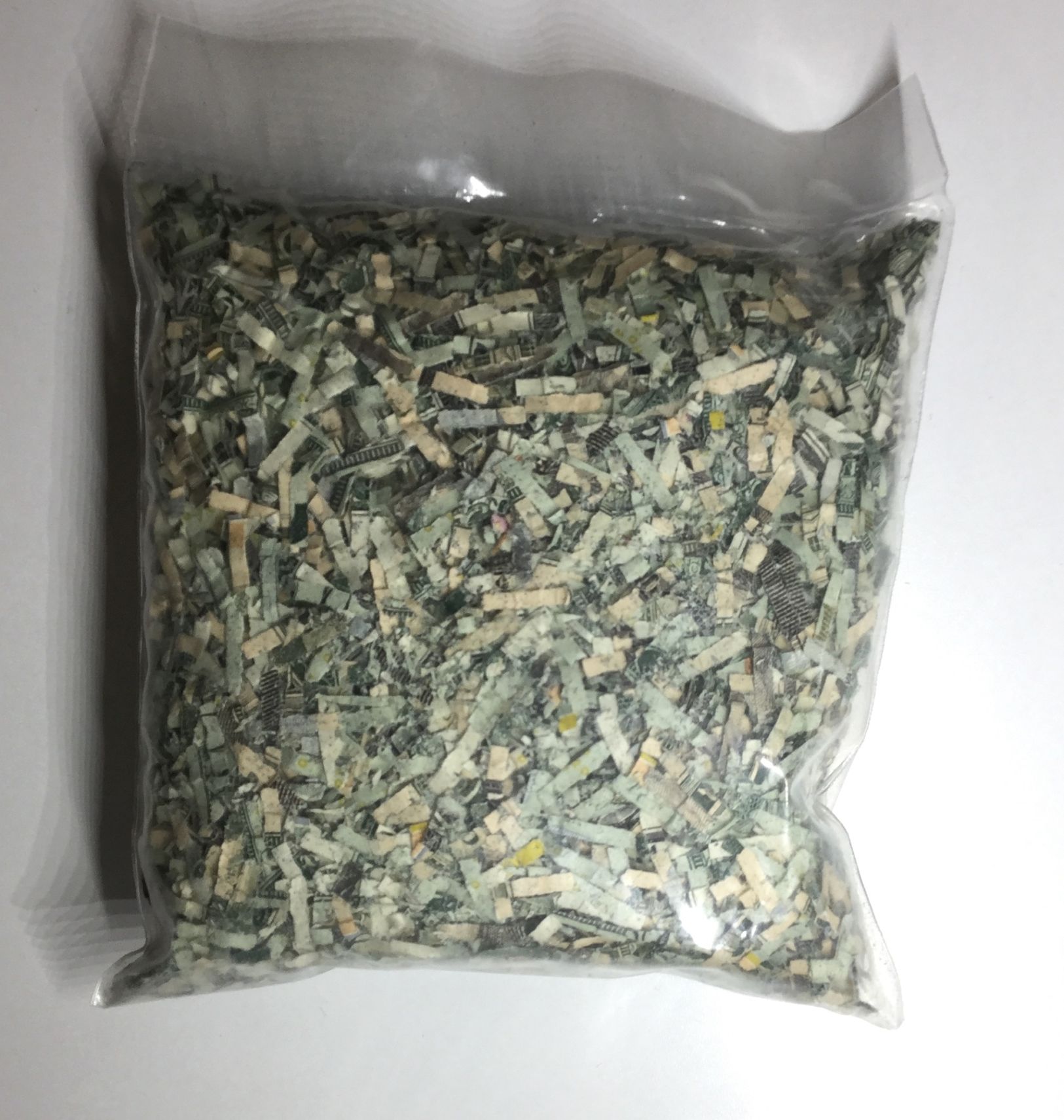 Unusual-Ebay-Auction:-Shredded-Federal-Reserve-Notes-In-Small-Jar
