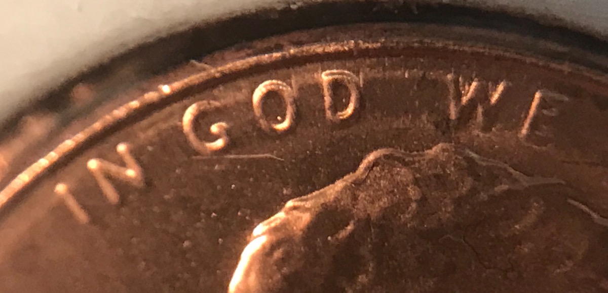 What-Causes-This-Metal-Movement-Near-Rim-Of-This-Cent?