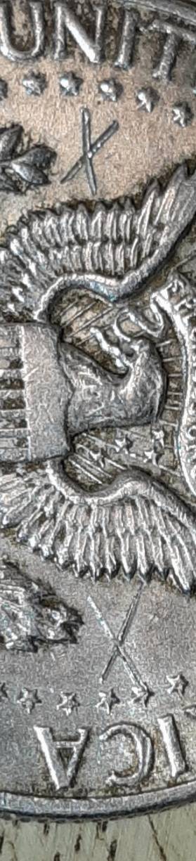 1964-Kennedy-Half-With-3-X-Shaped-Die-Crack-Marks-On-It