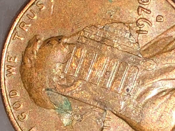 Penny-With-Nickel-Stamped-On-It