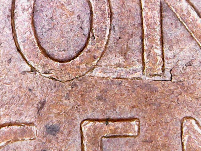 Need-Help-With-A-1945-D-LWC-Possible-Struck-Through-Staple-Or-Metal-Scrap?