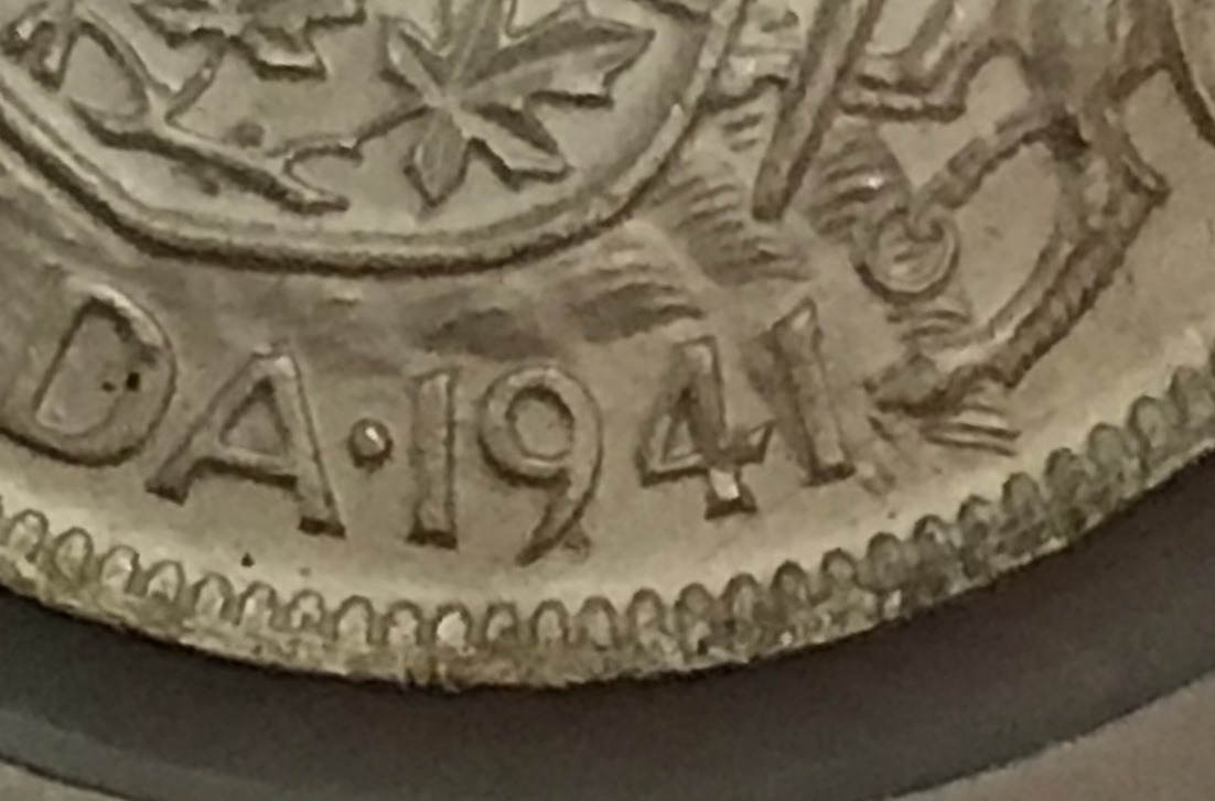 Difference-Between-A-Narrow-And-Wide-Date-On-The-1941/42-Fifty-Cent-Coin