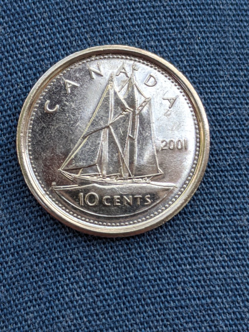 2001-Dime,-Die-Chip-Or-Gas-Bubble?