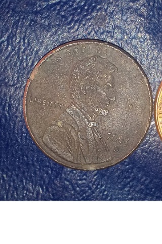 2002-D--Lincoln-Cent.-Bigger-Than-Most-Pennies-And-Oddly-Colored