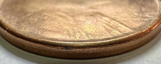 1995-Lincoln-Cent-Struck-Through-A-Late-Stage-Die-Cap