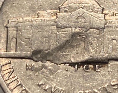 What-Would-This-Indent-On-1979-D-Nickel-Be-Considered..?
