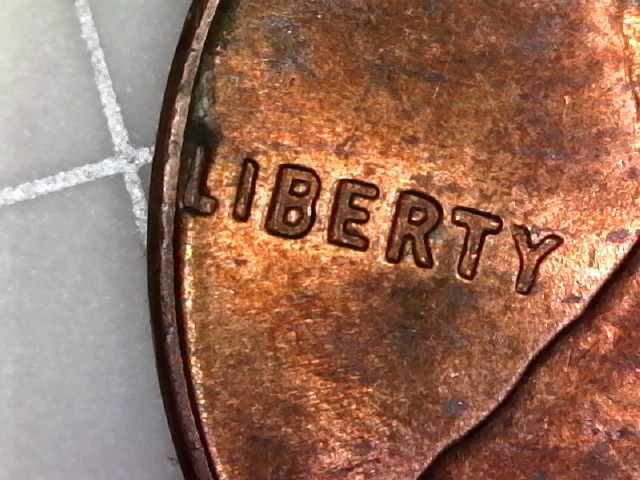 1965-Penny-Weird-L-And-E-On-Obverse?