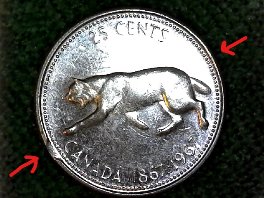 1967-Canadian-Bobcat-25c-Error,-Or-Damage?