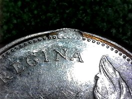 1967-Canadian-Bobcat-25c-Error,-Or-Damage?