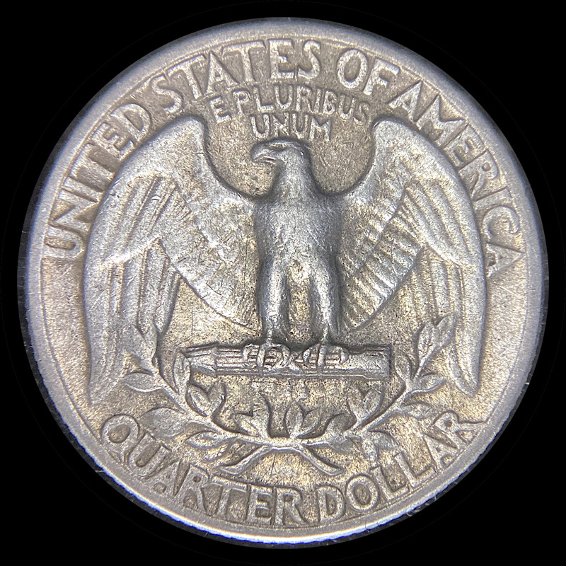 Sticky-Film-On-Silver-Quarter,-Impervious-To-Hot-Water-And-Acetone.
