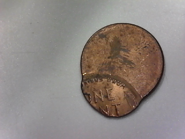 Three-Lincoln-Cents-Struck-Off-Center-And-One-?-Jewelry-Piece?