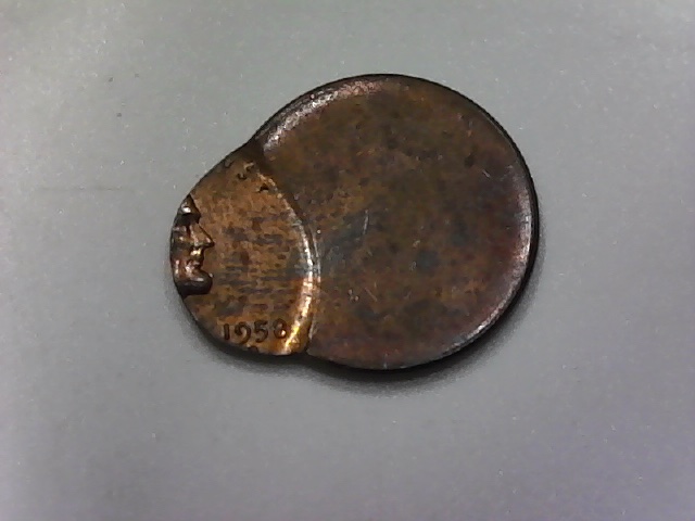 Three-Lincoln-Cents-Struck-Off-Center-And-One-?-Jewelry-Piece?