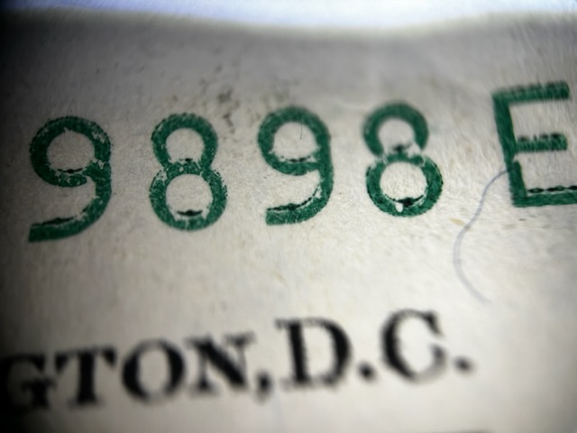 Series-2009-One-Dollar-Bill.-Over-Inked-Serial-Number?