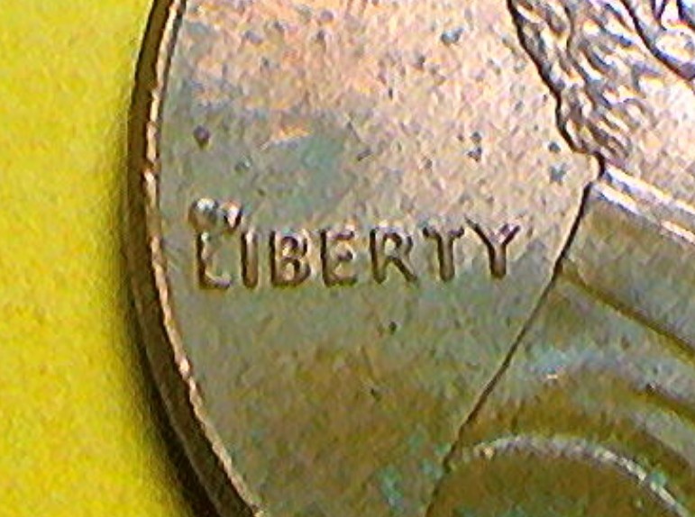 2006-Penny-With-Possible-Die-Chips-And-Blister-In-L-Obverse