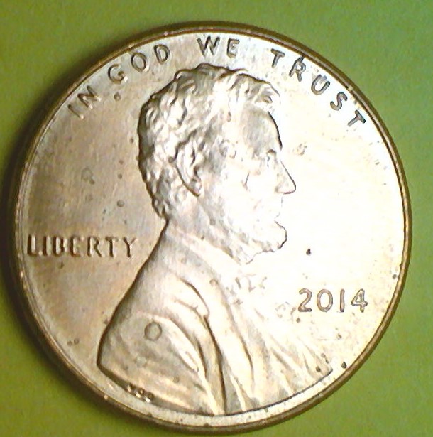 2014-Penny-With-Die-Chip-On-Top-Of-Shield