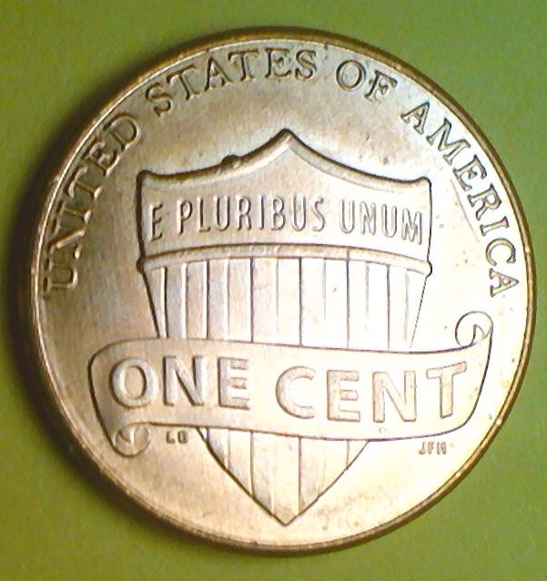 2014-Penny-With-Die-Chip-On-Top-Of-Shield