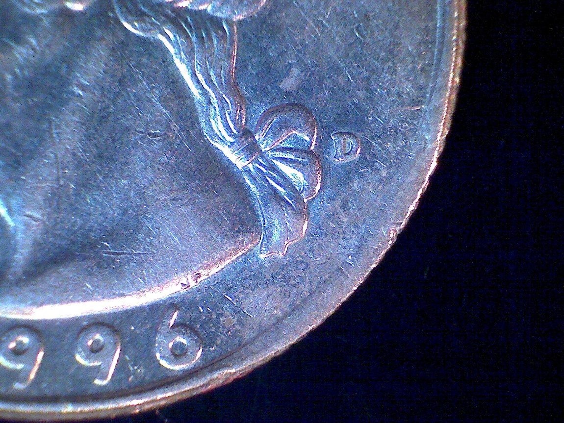 1996-Quarter,-Looks-Like-2-Curved-Clips-In-Same-Clip