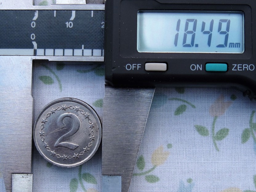 Please-Identify-This-Coin/Token-With-Value-Of-2-And-A-Songbird