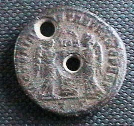 Holed-Coins-:-How-Much-Does-It-Lower-The-Value