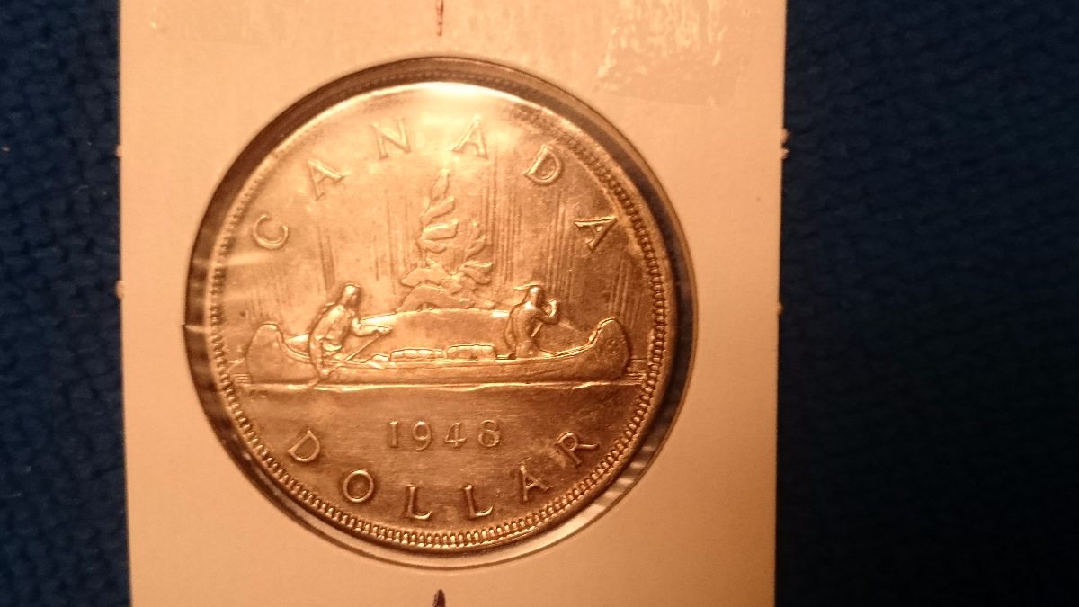 Grade-Of-This-Canada-1948-Silver-Dollar-With-Slight-Die-Rotation