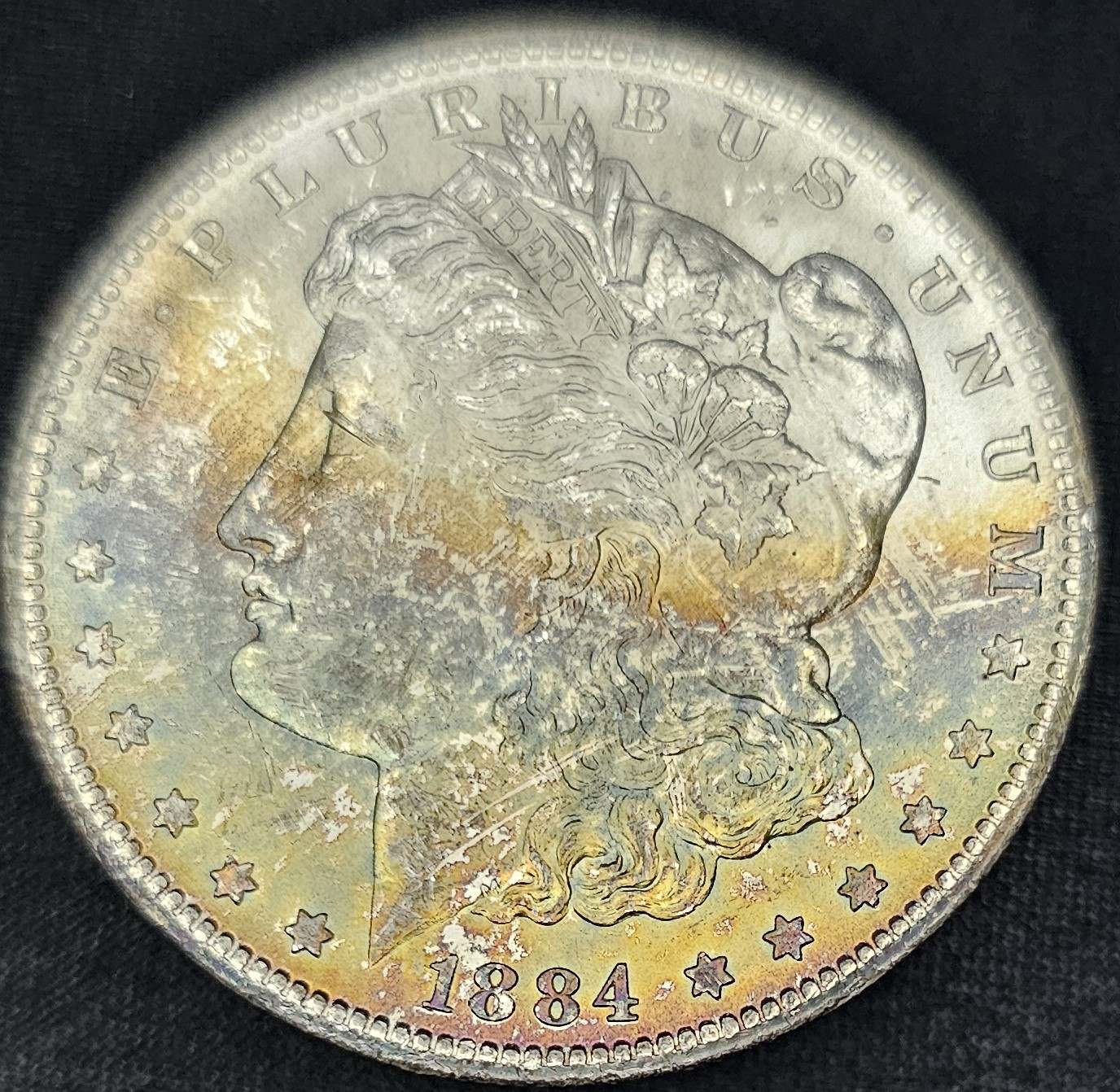 1884-CC-Morgan-Dollar---Rainbow-Toning