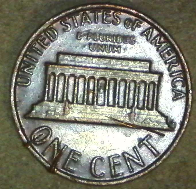 1982-Penny-Marks-On-Rim-And-Others-Damage?