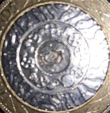 Q-Stamped-On-Both-Sides-Of-A-£2-Coin.