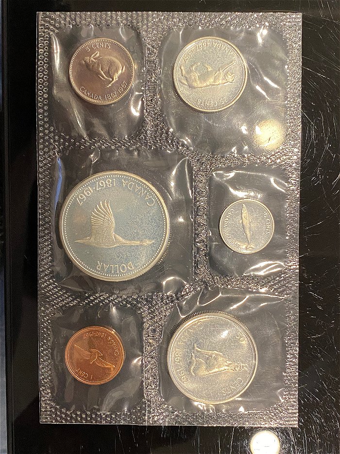 1963-Canada-Dollar-In-Mint-Plastic-Is-This-Not-MS-66-Grade?