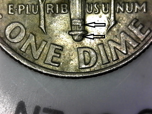 2007-P-Dime-With-Broken-Band-And-Tear-Drop-Like-At-The-Base-Of-The-Torch.