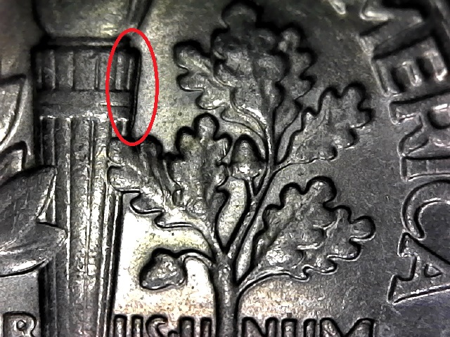 2000-D-Dime-With-Something-Extra-In-The-Torch-Band.