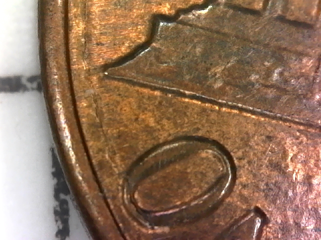 1984-D-Lincoln-Penny-With-Semi-Circular-Crack-In-Reverse.