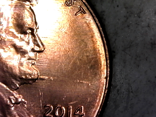 2014-D-Lincoln-Penny-With-Something-Protruding-From-His-Beard.
