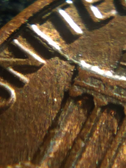 1983-Penny-With-Melted-8-And-A-Possible-Crack-In-The-Back.