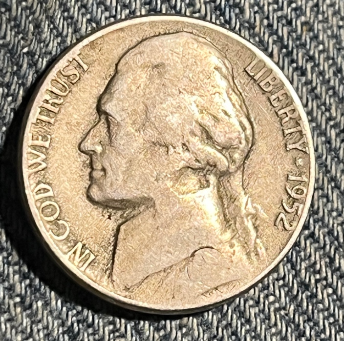 1952-P-Jefferson-Nickle.-The-Shape-Of-The-Ring-Around-The-Three-Holes-Is-?-Damage-From-?