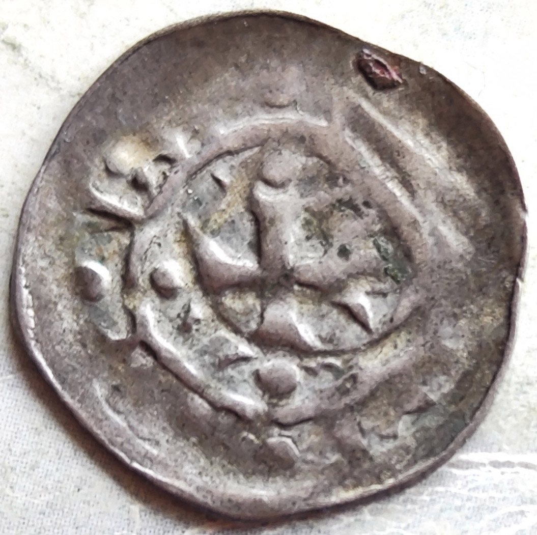 Silver-Coin-With-A-Cross-And-A-Hand