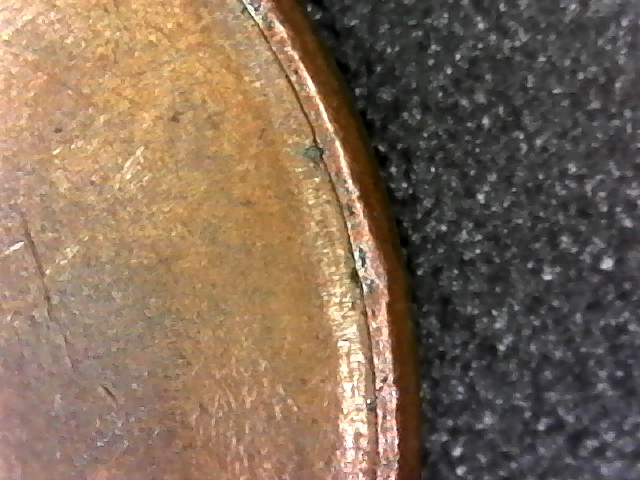 1987-D-Penny-RPM-&-Parallel-Lines-Running-Around-Half-Of-Edge-Of-Coin