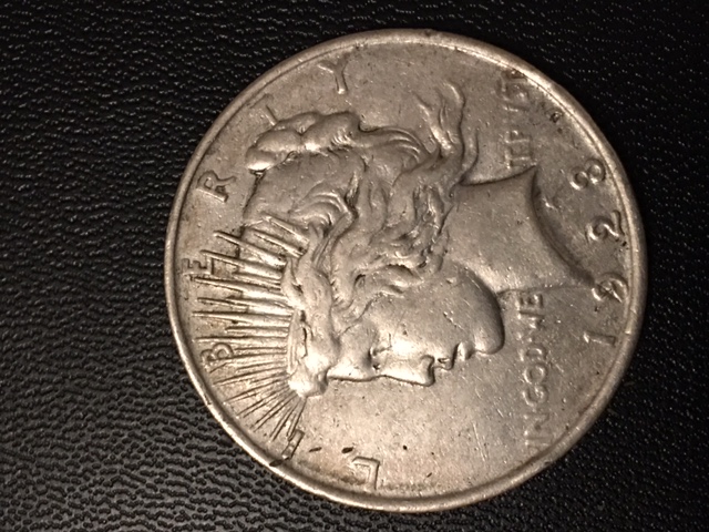 1923-P-Peace-Dollar,-Neck-Crossing-The-Date